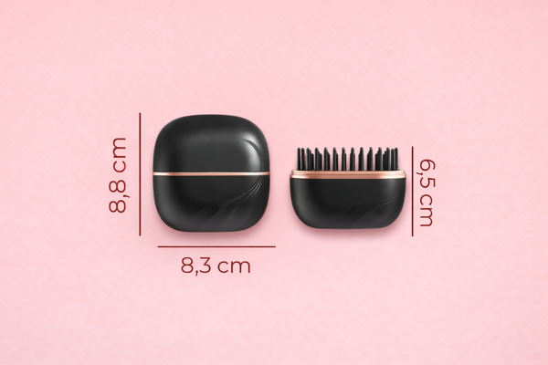 Kompakte schwarze Haarbürste mit Rosenvergoldung.png